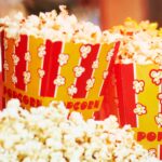 Closeup of movie theater popcorn that is on the list of foods to avoid with braces