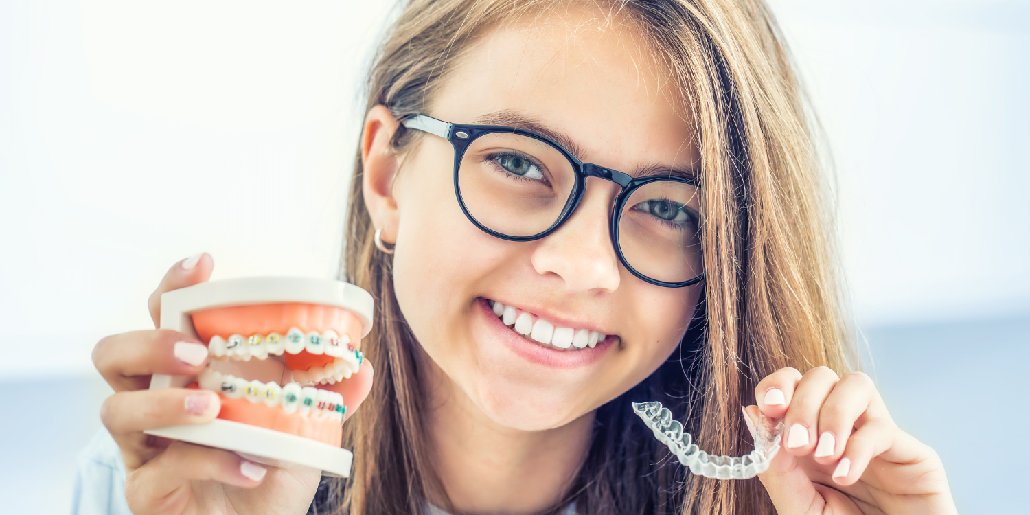 Brunette girl with glasses compares braces with clear aligners for her orthodontic treatment
