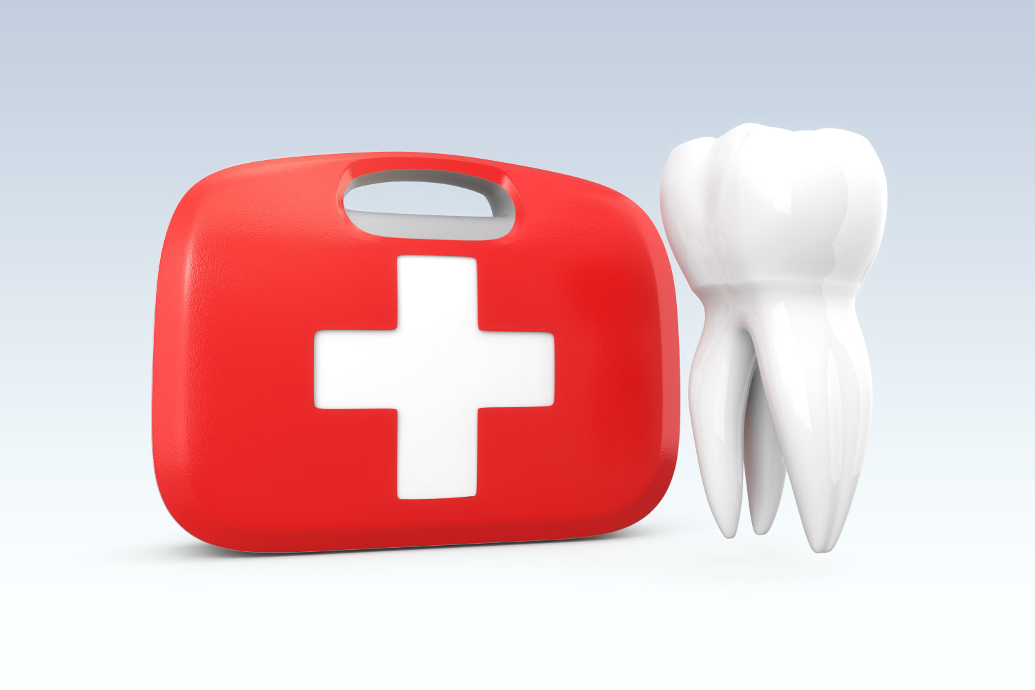 A white tooth floats next to a red and white emergency first aid kit
