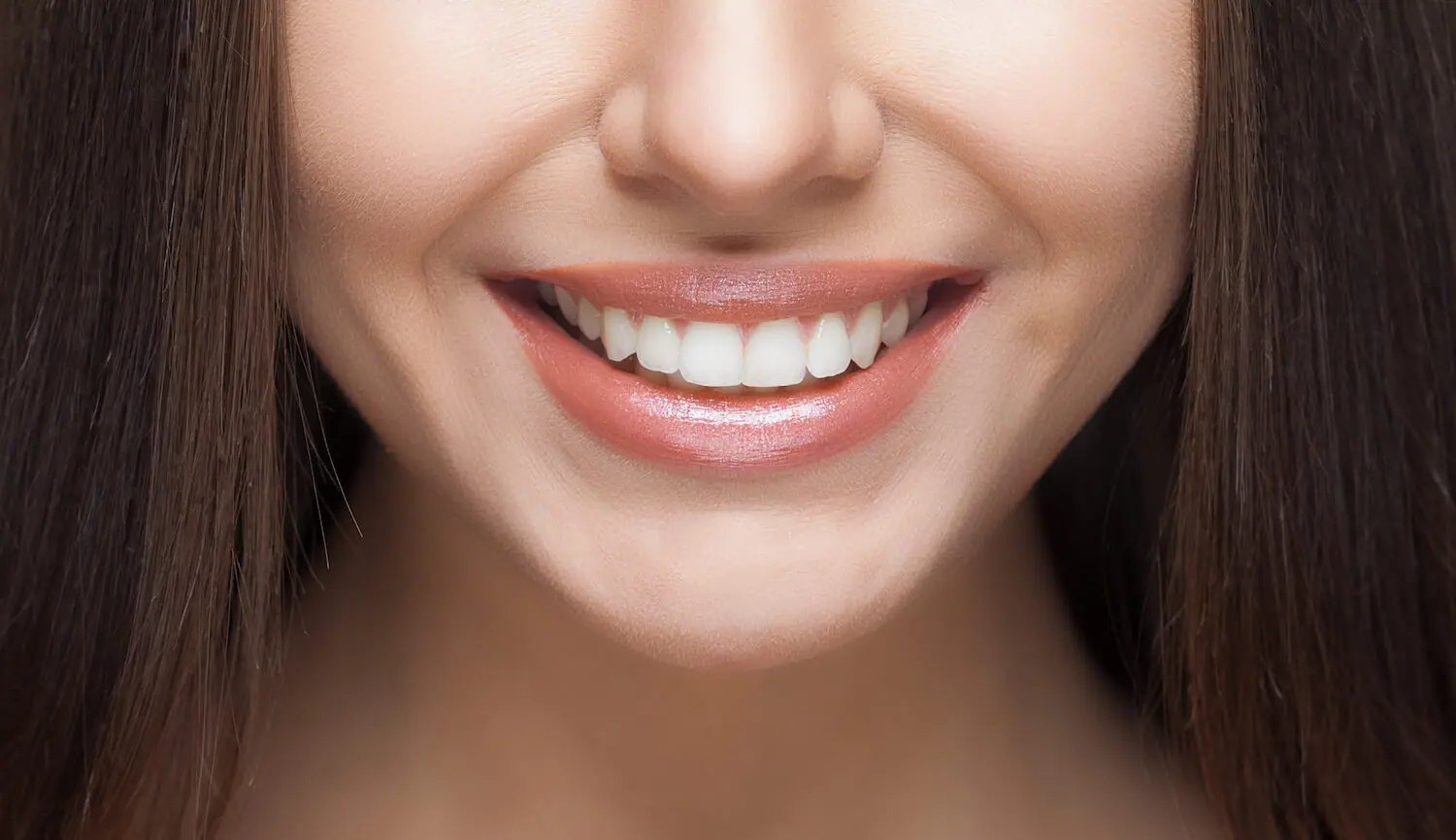 Closeup of a woman with a beautiful, white, straight smile