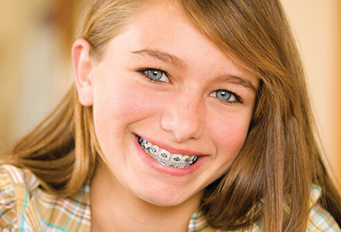 smiling girl wearing braces