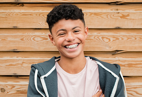 smiling boy with braces
